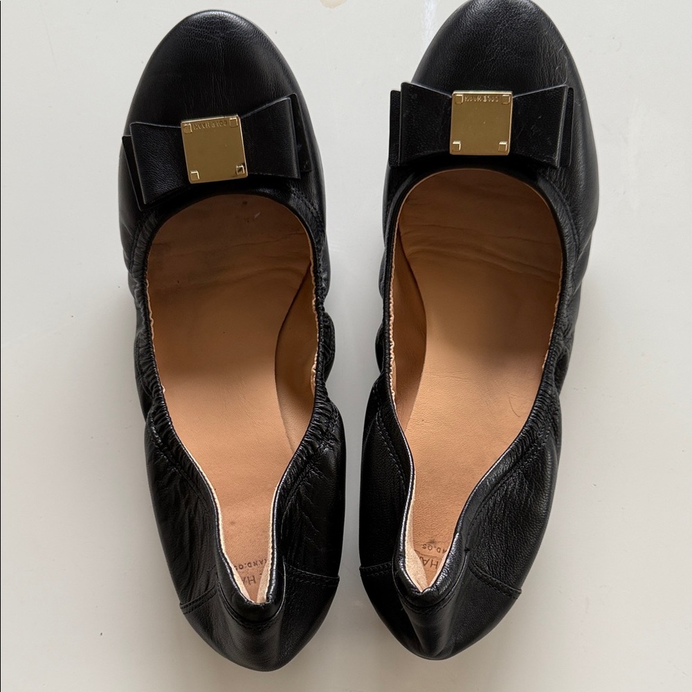 Cole Haan Black Leather Flats with Gold Bow Accent